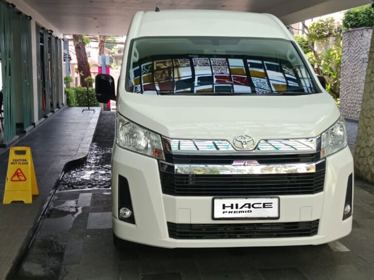 Modern Toyota Hiace Premio interior with driver - Hiace Premio Rental Bali
